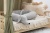 Bed bumper, linen cuddly toy in the shape of a light gray beige  dachshund, for a children's bed, cuddlerest.jpg